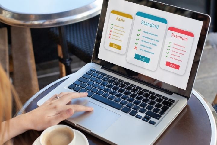 Laptop displaying subscription plan options while comparing small business sourcing platforms