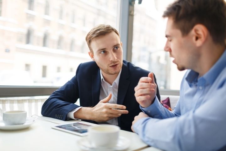 Buyer discussing off market business opportunities with a broker